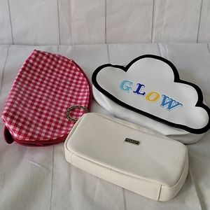 Lot of three large cosmetic bags.